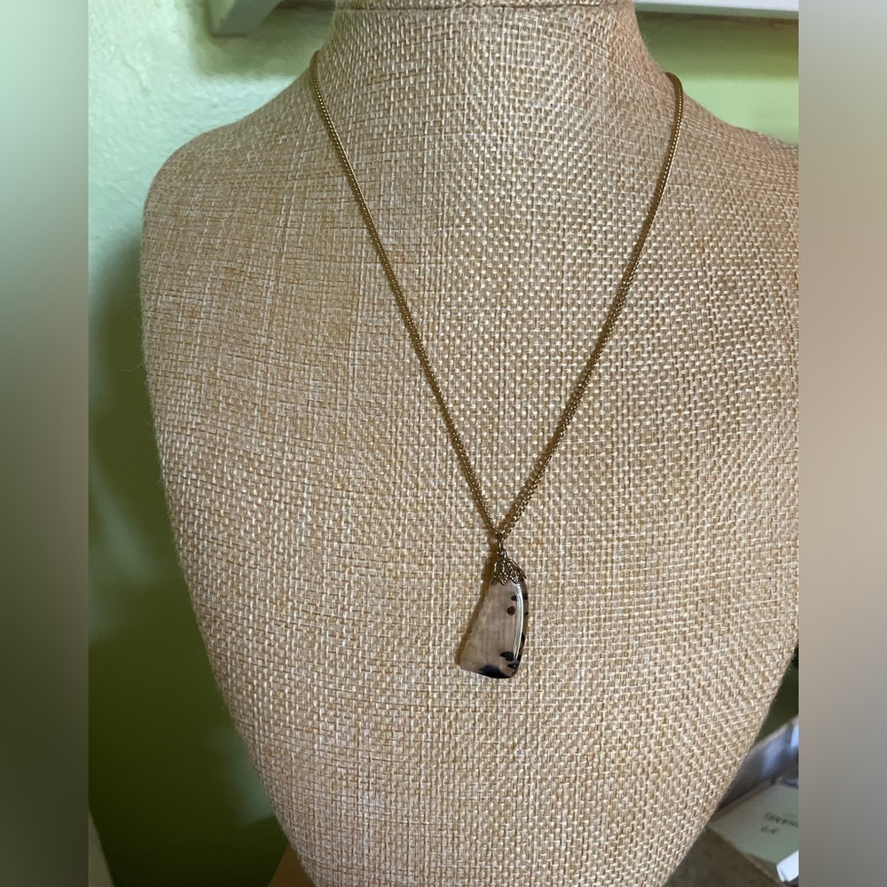 Gold necklace with unique stone pendant